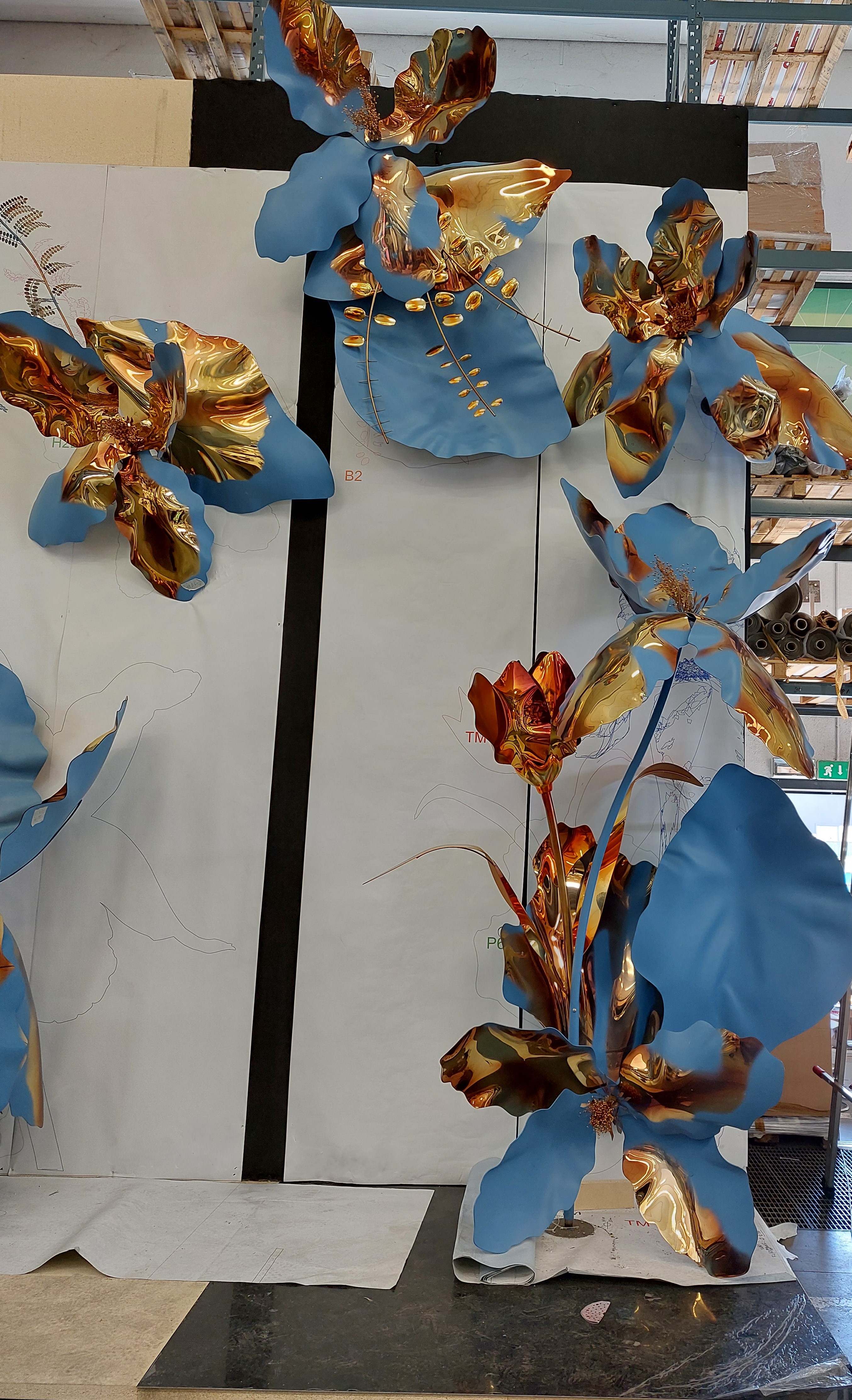 Full-scale pre-assembly of Louis Vuitton Blooming Flowers sculptural components against 1:1 reference templates