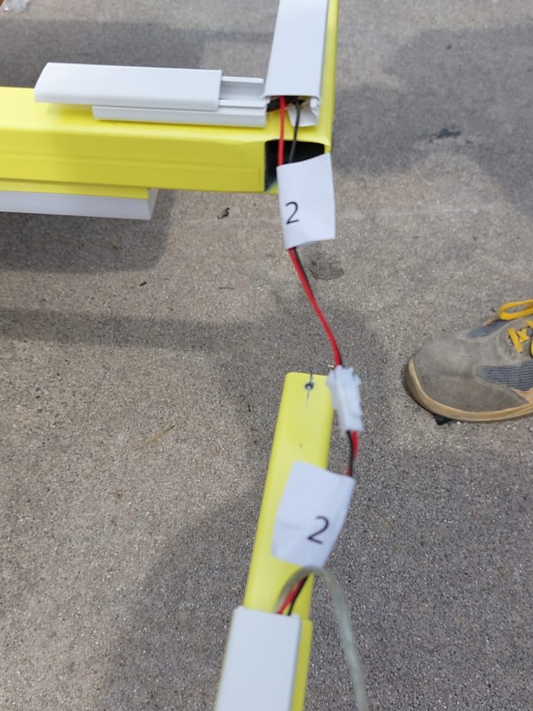 Electrical connections and numbered components during pre-assembly of an H&M Move display unit