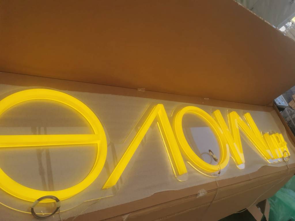 Illuminated H&M Move signage during production testing