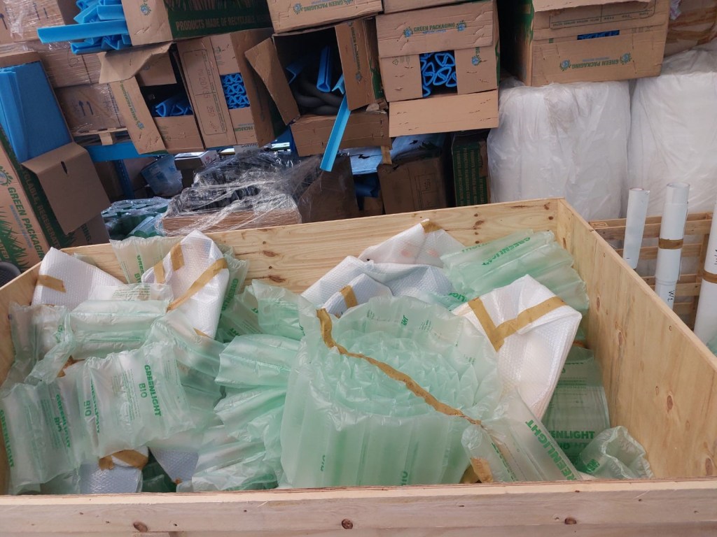 Warehouse packing preparation with custom crate and protective materials for Louis Vuitton window components