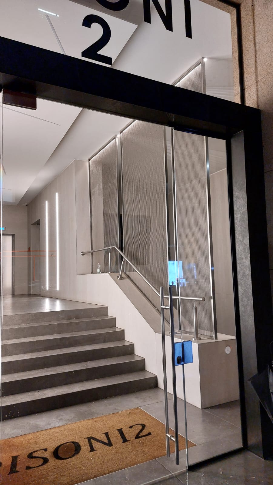 Entrance to the Milan showroom location followed during Kering Eyewear installation and dismantling