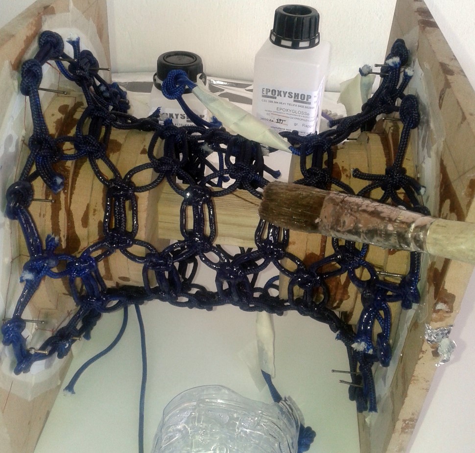 Epoxy resin being applied to stabilize the woven rope structure of the Knotlight prototype