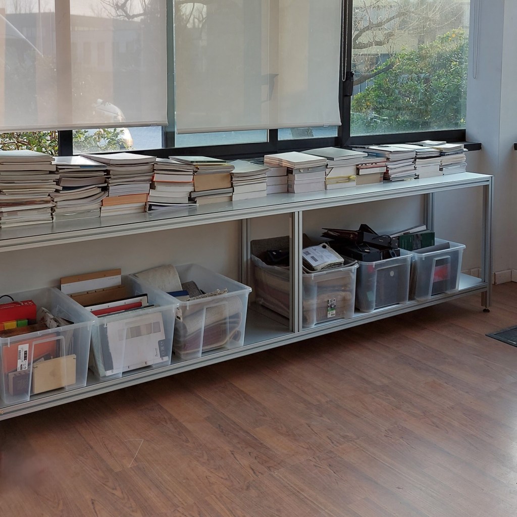 Oltrefrontiera Material Library with custom low shelving integrated beneath the windows