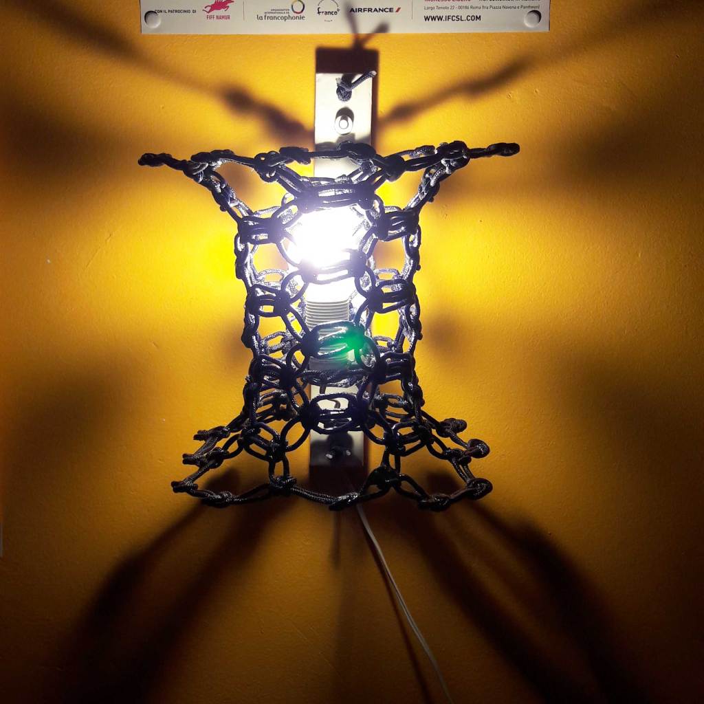 Illuminated RAFF Knotlight prototype showing the woven rope structure and integrated light source